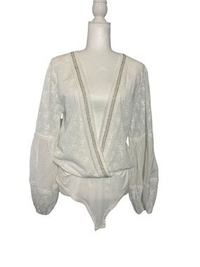 NWOT POL Lost Girl white wrap body suit with floral embroidery and rhinestone tr